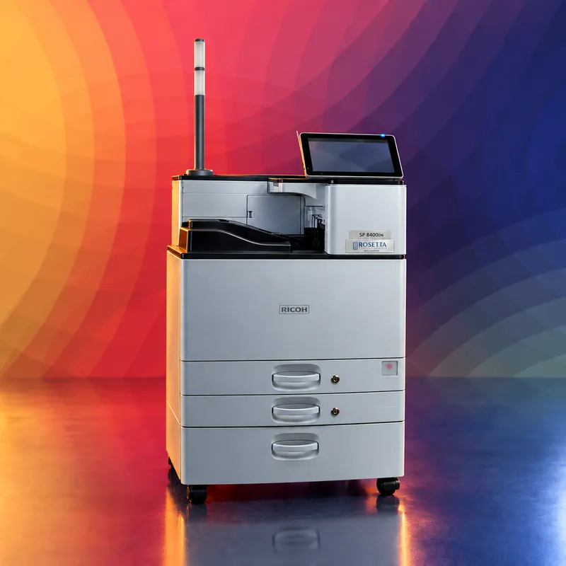 The SP 8400DNM MICR printer with its status pole, on Rosetta Technologies' brand art
